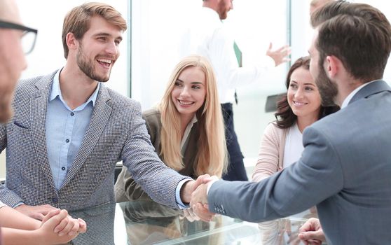 handshake business people at an informal meeting