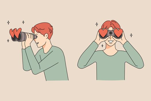 Happy man look in binoculars search for love