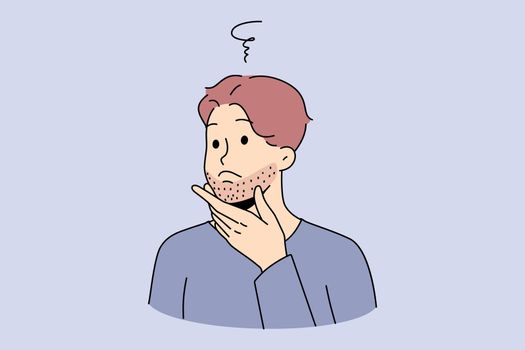 Man touching beard think of shaving