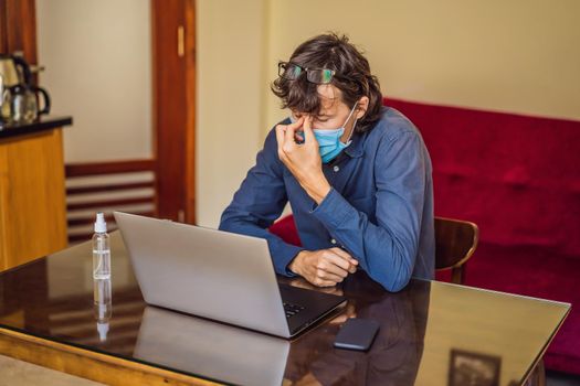 Coronavirus. Man working from home wearing protective mask. quarantine for coronavirus wearing protective mask. Working from home