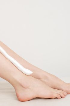 Bare legs with shaving foam