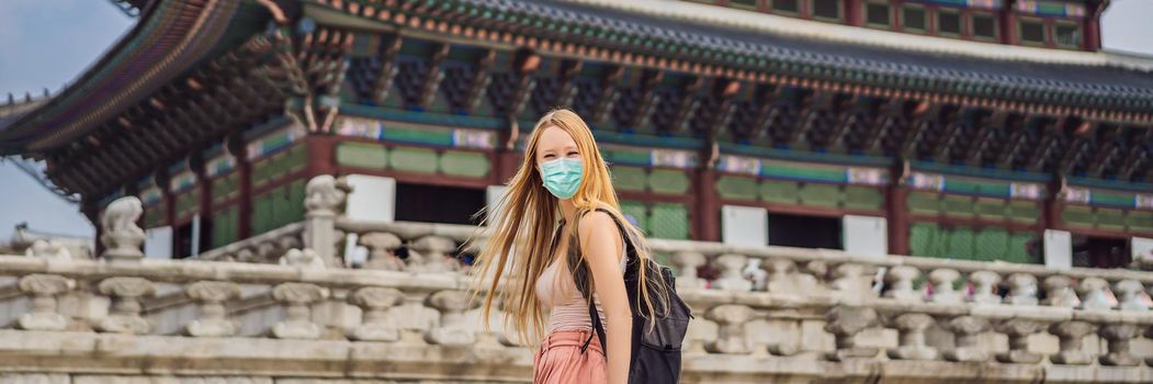 Woman tourist in medical mask in Seoul, South Korea. Travel to Korea concept Tourists fear the 2019-ncov virus. Medical masked tourists BANNER, LONG FORMAT