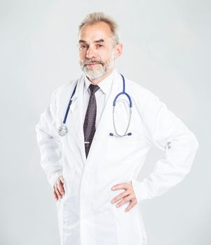 experienced therapist with a stethoscope on light background.