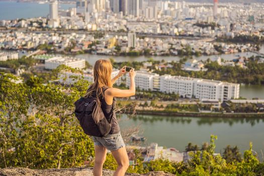 Woman tourist on the background of Nha Trang city. Travel to Vietnam Concept