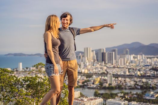 Happy couple tourists on the background of Nha Trang city. Travel to Vietnam Concept