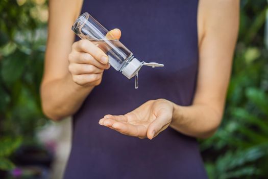 Women's hands using wash hand sanitizer gel