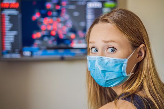 Young woman checks coronavirus sars-cov-2 covid-19 global cases situation online. Coronavirus outbreak in United States of America and World