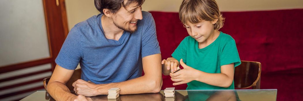 Happy Family Playing Board Game At Home BANNER, LONG FORMAT