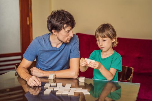 Happy Family Playing Board Game At Home