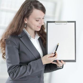 modern business woman pointing at blank sheet.