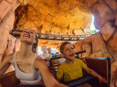 Mother and son having fun on rollercoaster