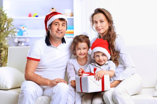 Portrait of happy family in Christmas hat