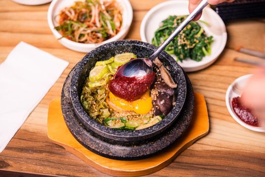 Korean traditional dish- bibimbap mixed rice with vegetables Include beef and fried egg
