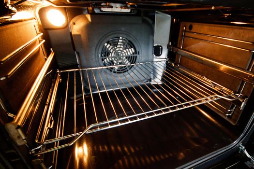 Open oven with forced draft fan and lighting