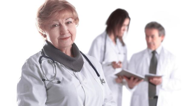 adult female doctor therapist on blurred background of colleagues