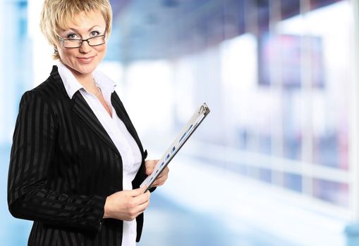 Image of pretty businesswoman looking at camera