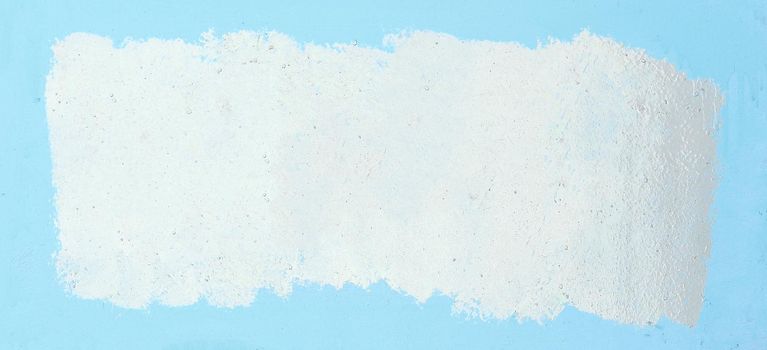 painted white frame on a blue background. photo with copy space