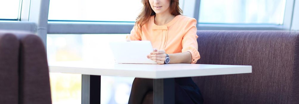 woman consultant using a digital tablet in the workplace in the office