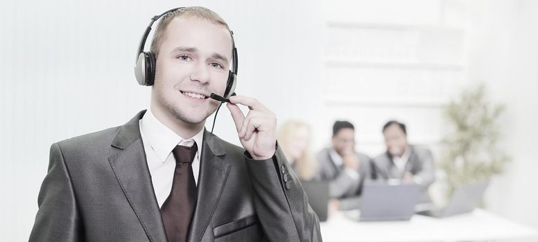 responsible employee call center with headset on the background