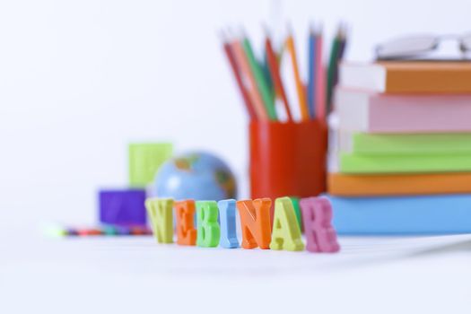 word webinar on blurred background .photo with copy space