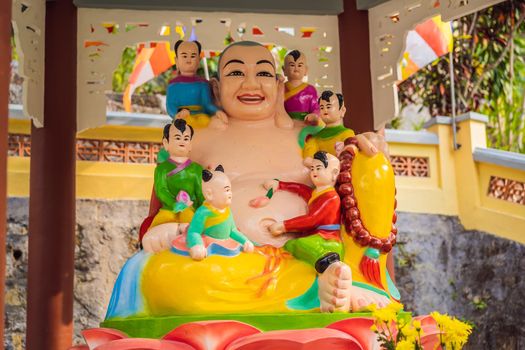 Colored buddha in vietnamese style. Vietnam temple