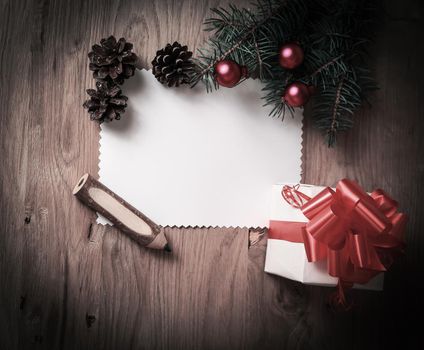blank Christmas card and a box with gift on Christmas background