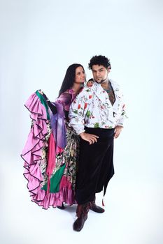 professional dance couple in a Gypsy costume perform folk dance