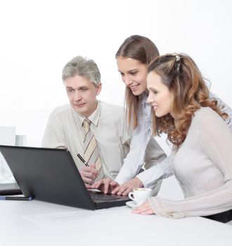 senior Manager and employees looking at laptop screen