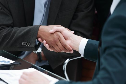 closeup.handshake trading partners on the background of the workplace