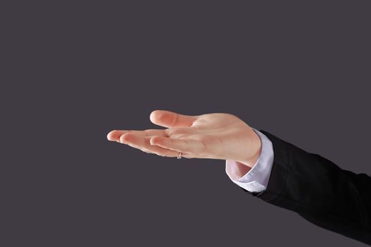close up. business woman showing open palm .isolated on black background