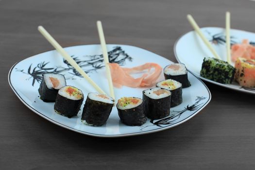 Roll of sushi prepared from raw fish and a special rice