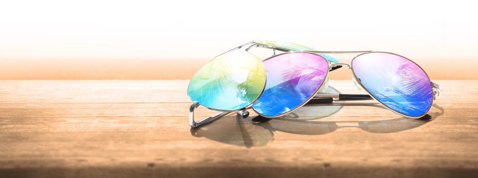 Summer tropical beach background with fashionable sunglasses.