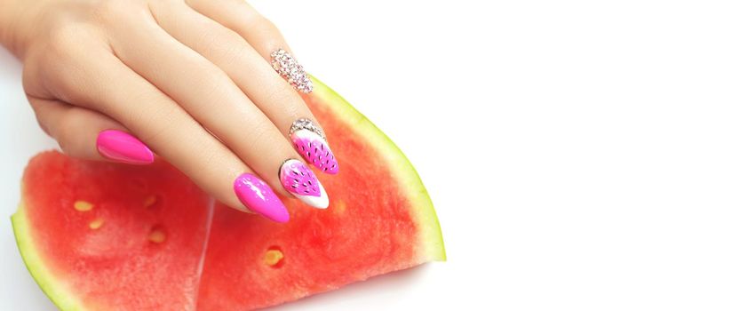 Hand with fashion manicure holding watermelon on white background.