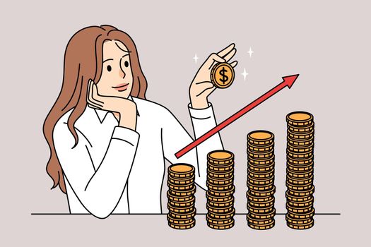 Successful businesswoman stacking coins