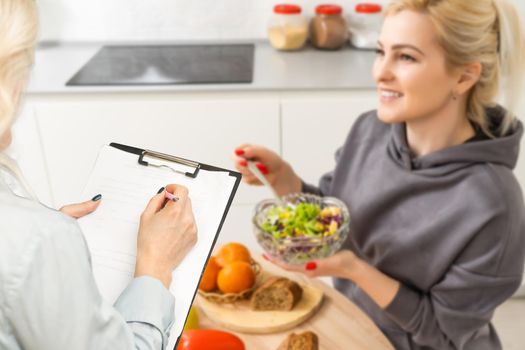 teacher female nutritionist advises about eating health Define diets work kitchen studios diet plans medical weight loss or video call interested parties and consult online in live broadcasts.