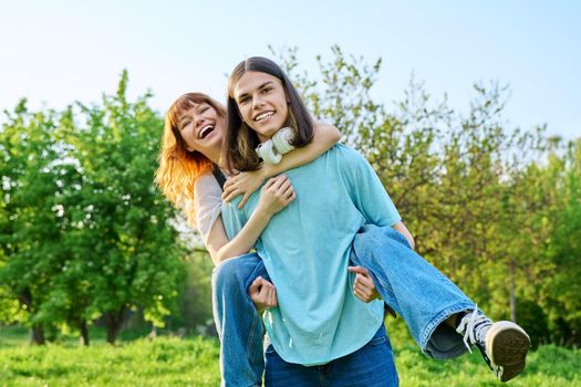 Happy laughing youth, having fun couple of teenagers outdoor