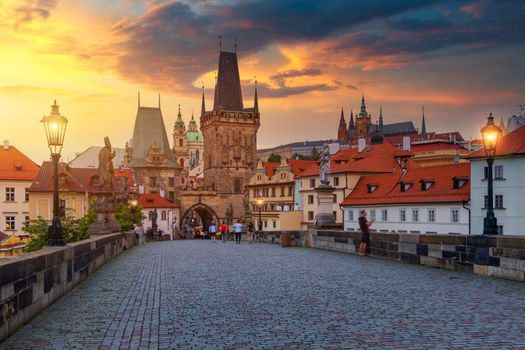 Charles Bridge in Prague at sunset. Prague, Czech Republic. Charles Bridge (Karluv Most) and Old Town Tower. Vltava River and Charles Bridge. Concept of world travel, sightseeing and tourism.