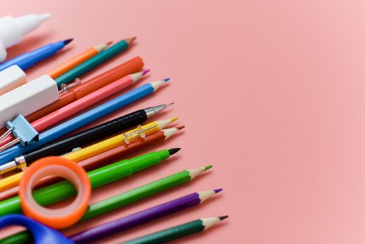 school supplies stationery on pink background. View from above