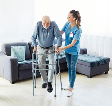 nurse doctor senior care caregiver help walker assistence retirement home nursing elderly man