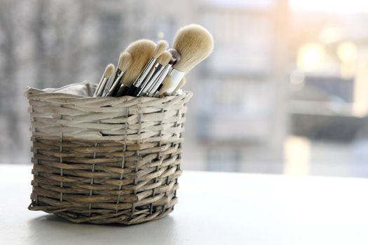 A set of makeup brushes in their container