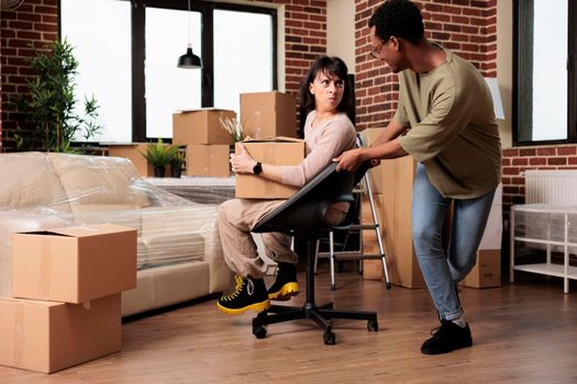 Married homeowners enjoying moving in new rented flat