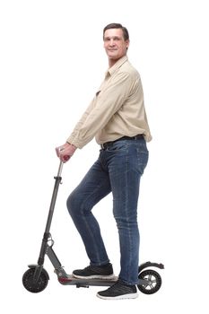 Side view of happy man rides a black kick scooter