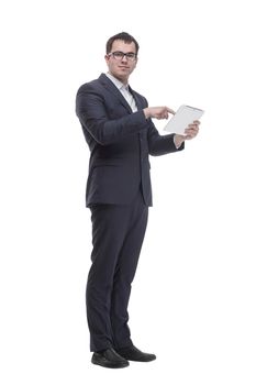 Side view portrait of curious and smiling businessman with tablet looking and pointing to side