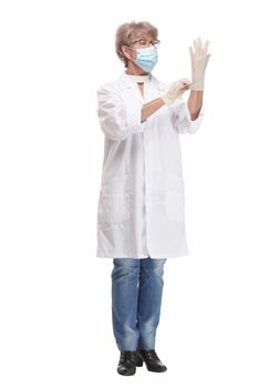 Confident experienced young doctor woman with face mask and gloves isolated on white background