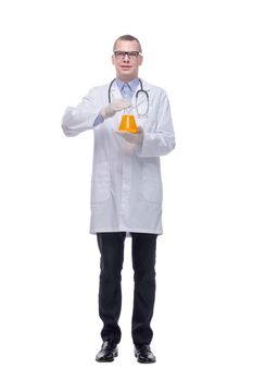 Confident man doctor wearing unifrom and glasses holding beakers