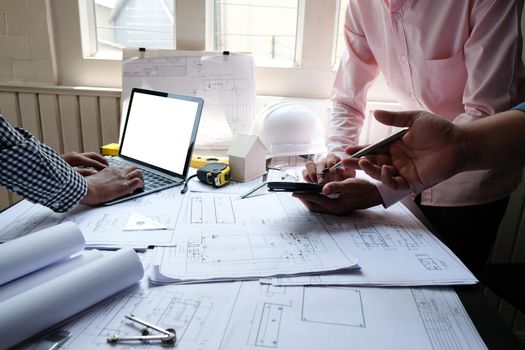 architect engineer team working on house blueprint of real estate project at workplace. construction & building concept
