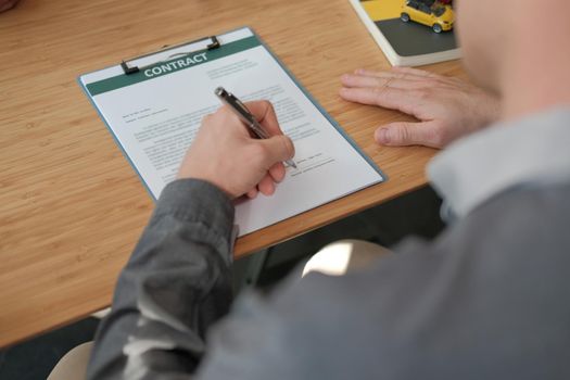 businessman signing mortgage loan contract agreement for buying home