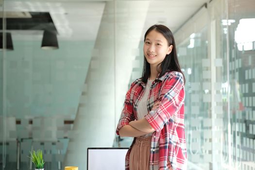 asian girl teenager posing at co-working space