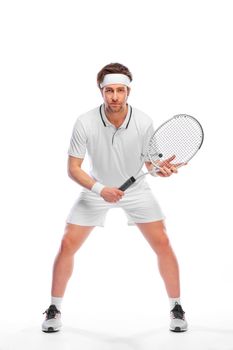 Tennis player with racket in white costume. Man athlete playing isolated on light background.