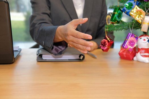 businessman offering handshake. man ready to shake hand during christmas holiday